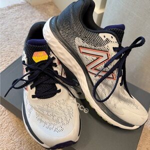 New Balance White and Black Sneakers with Orange Accents